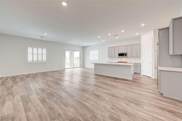 12436 Primrose Grove Ln, Las Vegas, NV 89138 - unfurnished living room with light wood-style floors and recessed lighting
