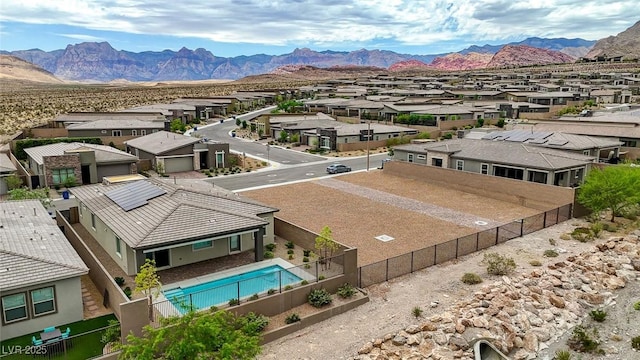 12436 Primrose Grove Ln, Las Vegas, NV 89138 - aerial perspective of suburban area featuring a mountainous background and a pool