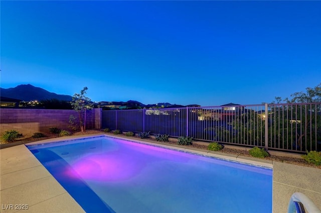 12436 Primrose Grove Ln, Las Vegas, NV 89138 - view of swimming pool with a fenced backyard and a mountain view