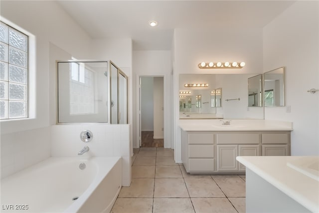 1312 Autumn Wind Way, Henderson, NV 89052 - full bathroom featuring vanity, a bath, a stall shower, and tile patterned flooring