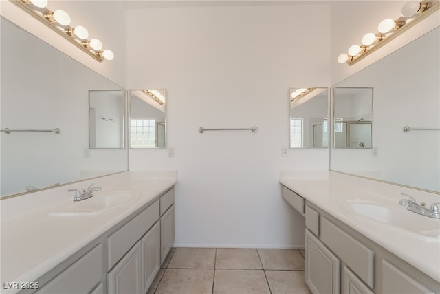 1312 Autumn Wind Way, Henderson, NV 89052 - full bathroom with two vanities, tile patterned flooring, and a shower with door