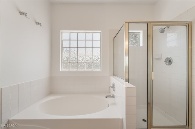 1312 Autumn Wind Way, Henderson, NV 89052 - bathroom with healthy amount of natural light, a bath, and a shower stall