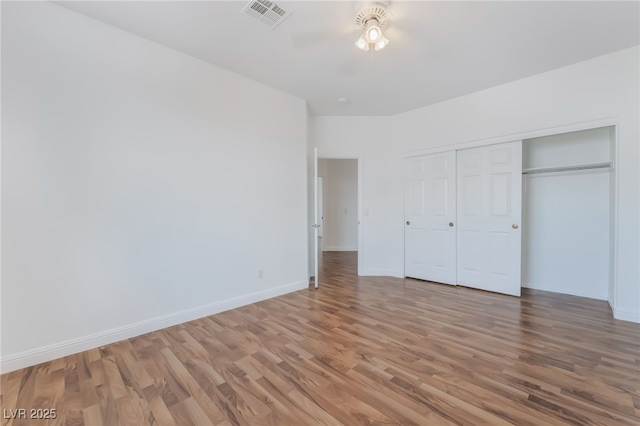 1312 Autumn Wind Way, Henderson, NV 89052 - unfurnished bedroom featuring wood finished floors, a closet, and ceiling fan