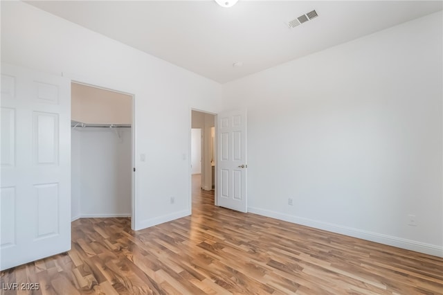 1312 Autumn Wind Way, Henderson, NV 89052 - unfurnished bedroom featuring light wood-type flooring and a closet