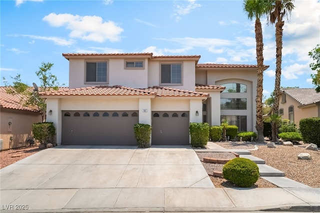 1312 Autumn Wind Way, Henderson, NV 89052 - mediterranean / spanish-style home featuring stucco siding, driveway, an attached garage, and a tile roof