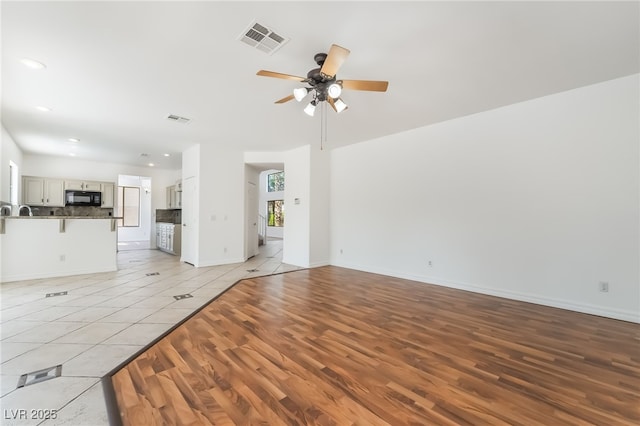 1312 Autumn Wind Way, Henderson, NV 89052 - unfurnished living room featuring ceiling fan, light wood-style floors, and recessed lighting