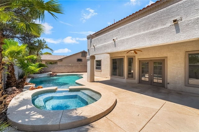 1312 Autumn Wind Way, Henderson, NV 89052 - view of swimming pool with a pool with connected hot tub, a patio area, french doors, and a fenced backyard