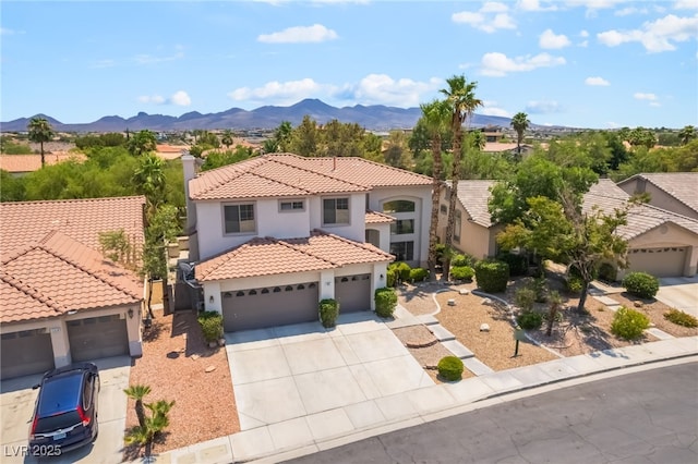 1312 Autumn Wind Way, Henderson, NV 89052 - mediterranean / spanish-style house featuring stucco siding, concrete driveway, and a mountain view