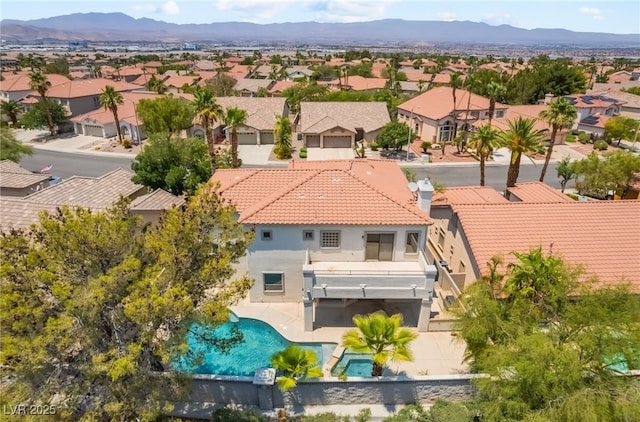 1312 Autumn Wind Way, Henderson, NV 89052 - aerial perspective of suburban area with a pool area and a mountain backdrop