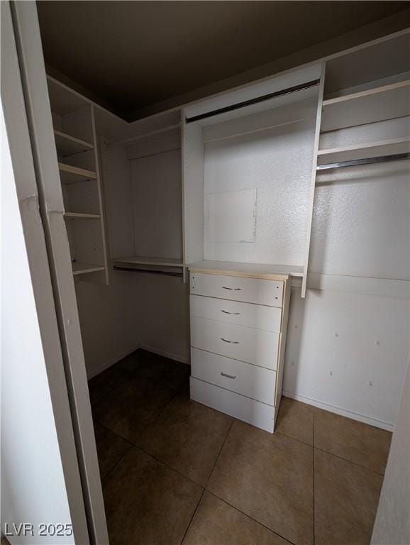 9182 Jewel Crystal Ct, Las Vegas, NV 89129 - walk in closet with dark tile patterned floors