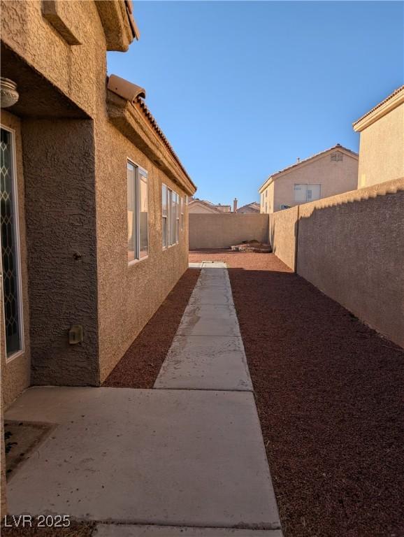 9182 Jewel Crystal Ct, Las Vegas, NV 89129 - fenced backyard with a patio