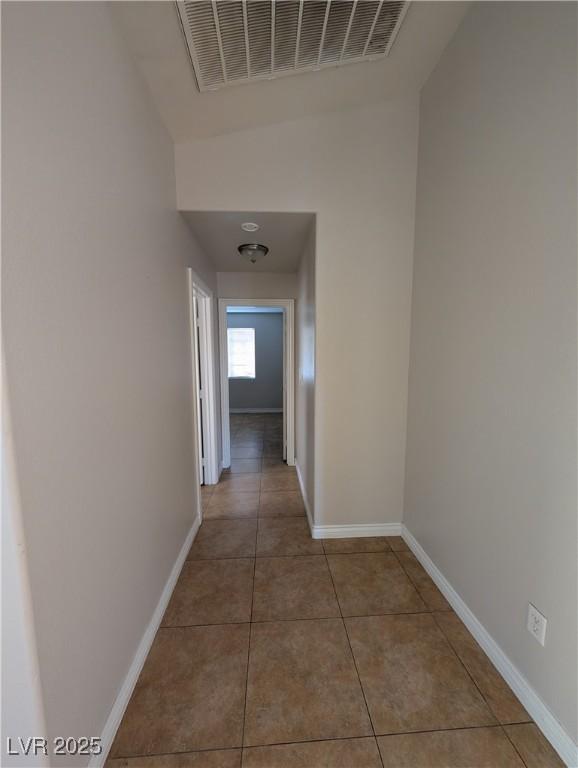 9182 Jewel Crystal Ct, Las Vegas, NV 89129 - hallway with baseboards and tile patterned floors