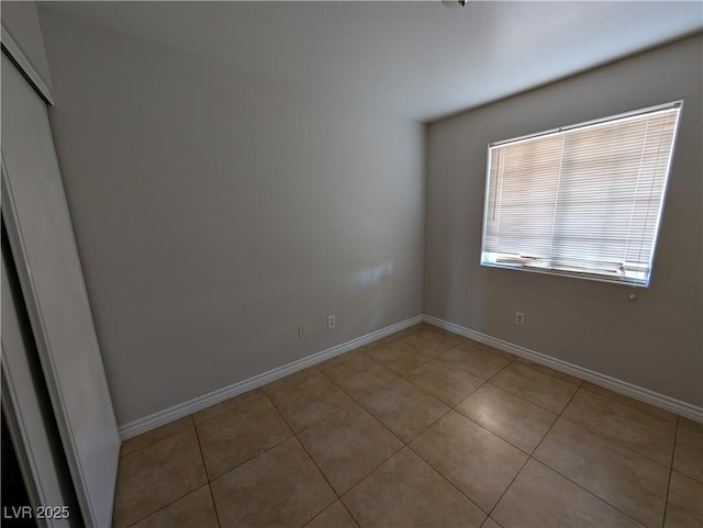 9182 Jewel Crystal Ct, Las Vegas, NV 89129 - spare room featuring light tile patterned flooring and baseboards