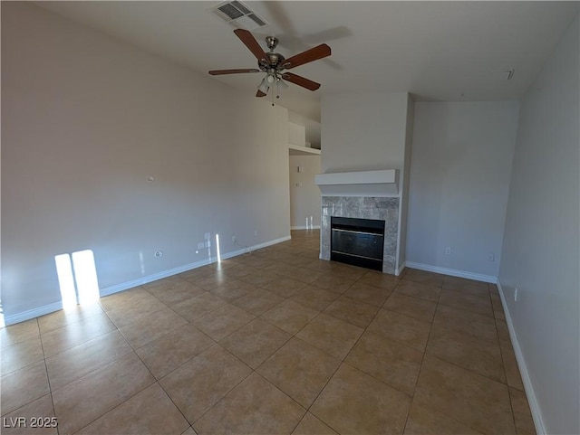 9182 Jewel Crystal Ct, Las Vegas, NV 89129 - unfurnished living room featuring ceiling fan, tile patterned floors, and a tiled fireplace