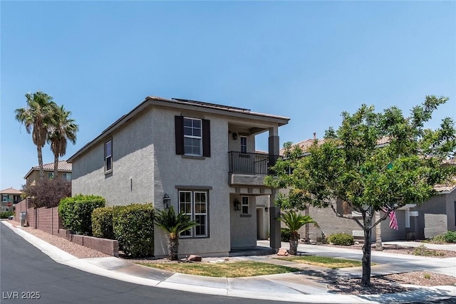 9305 Ironsend St, Las Vegas, NV 89143 - view of front facade featuring a balcony and stucco siding