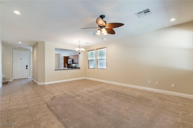 9305 Ironsend St, Las Vegas, NV 89143 - unfurnished room with a chandelier, ceiling fan, light tile patterned floors, and recessed lighting