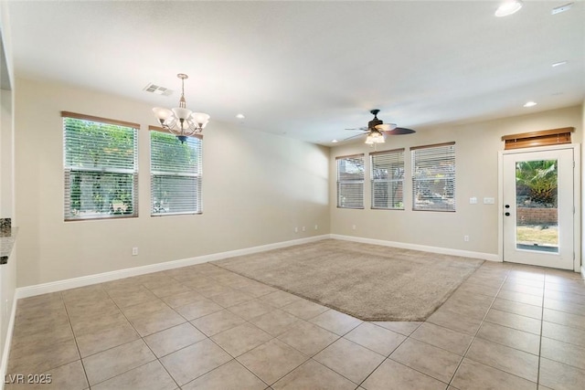 9305 Ironsend St, Las Vegas, NV 89143 - empty room featuring light tile patterned floors, ceiling fan, recessed lighting, and a chandelier