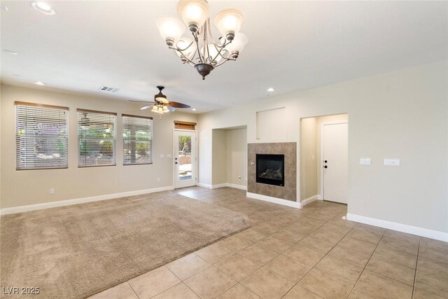 9305 Ironsend St, Las Vegas, NV 89143 - unfurnished living room featuring light tile patterned floors, ceiling fan, a tile fireplace, a chandelier, and recessed lighting