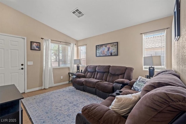 4928 Corsica Island St, North Las Vegas, NV 89031 - living area featuring vaulted ceiling and light tile patterned floors