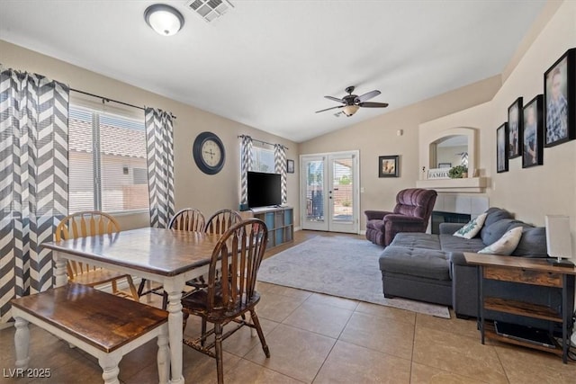 4928 Corsica Island St, North Las Vegas, NV 89031 - dining room with ceiling fan, lofted ceiling, and light tile patterned flooring