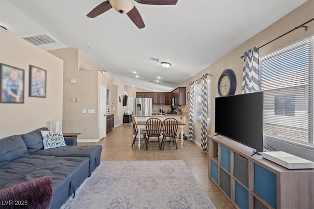 4928 Corsica Island St, North Las Vegas, NV 89031 - living area featuring vaulted ceiling, light tile patterned flooring, and ceiling fan