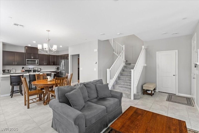 3310 Palindrome Ave, Henderson, NV 89044 - living area with a chandelier, light tile patterned floors, stairway, and recessed lighting