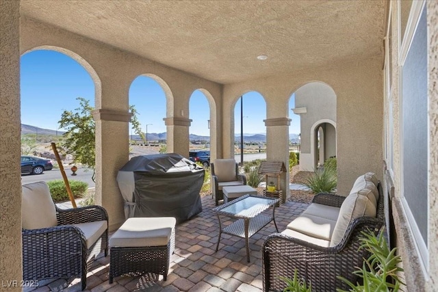 3310 Palindrome Ave, Henderson, NV 89044 - view of patio / terrace with a mountain view, an outdoor living space, and a grill
