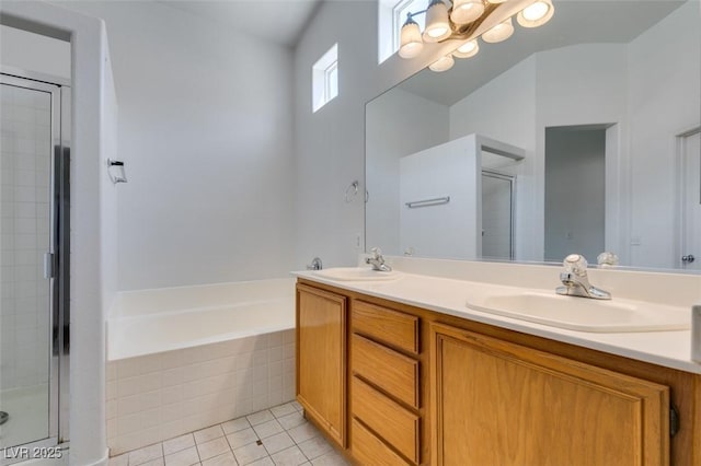 352 River Glider Ave, North Las Vegas, NV 89084 - bathroom with double vanity, tile patterned floors, a bath, and a shower stall