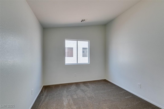 352 River Glider Ave, North Las Vegas, NV 89084 - spare room with dark carpet and baseboards