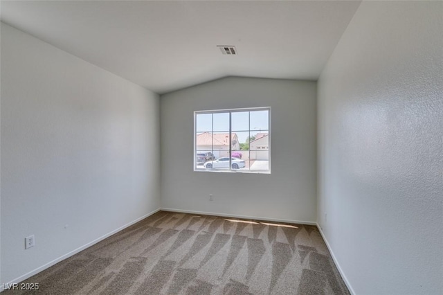 352 River Glider Ave, North Las Vegas, NV 89084 - carpeted spare room featuring vaulted ceiling and baseboards
