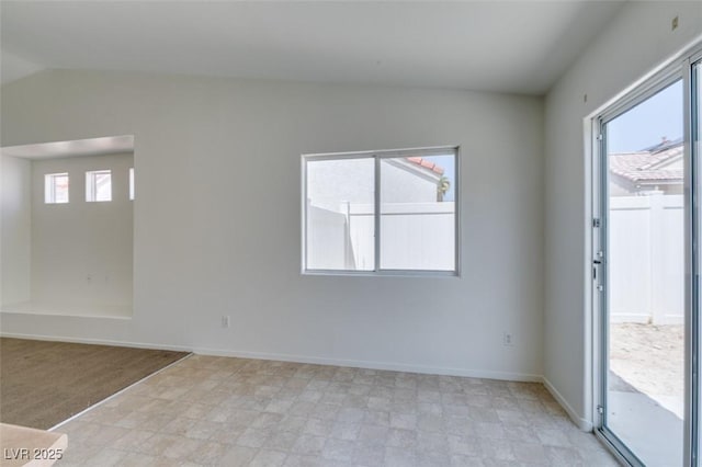 352 River Glider Ave, North Las Vegas, NV 89084 - unfurnished room featuring vaulted ceiling and baseboards
