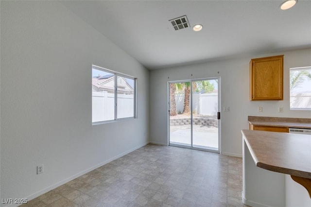 352 River Glider Ave, North Las Vegas, NV 89084 - unfurnished dining area with healthy amount of natural light, lofted ceiling, light floors, and recessed lighting