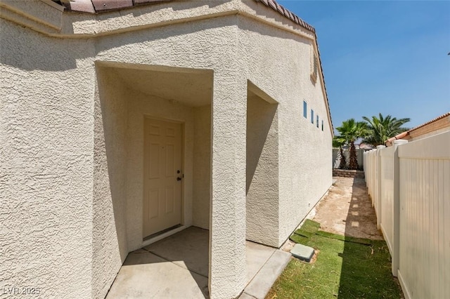 352 River Glider Ave, North Las Vegas, NV 89084 - doorway to property featuring stucco siding