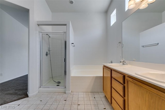 352 River Glider Ave, North Las Vegas, NV 89084 - bathroom with a garden tub, a stall shower, double vanity, and tile patterned flooring