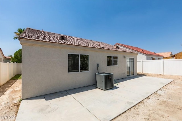 352 River Glider Ave, North Las Vegas, NV 89084 - rear view of house featuring stucco siding, a tiled roof, a fenced backyard, and a patio