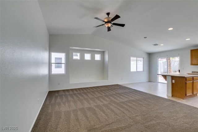 352 River Glider Ave, North Las Vegas, NV 89084 - unfurnished living room featuring vaulted ceiling, light colored carpet, a ceiling fan, and recessed lighting
