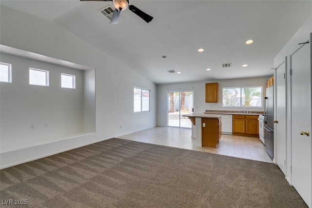 352 River Glider Ave, North Las Vegas, NV 89084 - kitchen with white appliances, light colored carpet, open floor plan, plenty of natural light, and recessed lighting