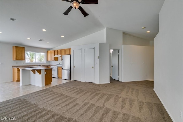 352 River Glider Ave, North Las Vegas, NV 89084 - unfurnished living room with lofted ceiling, ceiling fan, recessed lighting, and light carpet