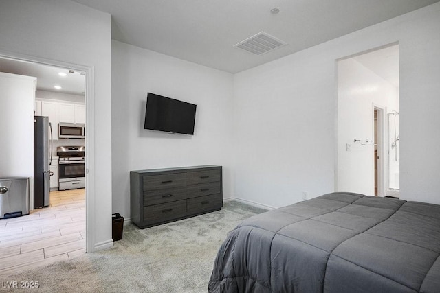 9740 Redwood Cascade St, Las Vegas, NV 89143 - bedroom featuring freestanding refrigerator and light colored carpet