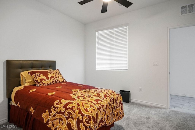 9740 Redwood Cascade St, Las Vegas, NV 89143 - carpeted bedroom with a ceiling fan and multiple windows