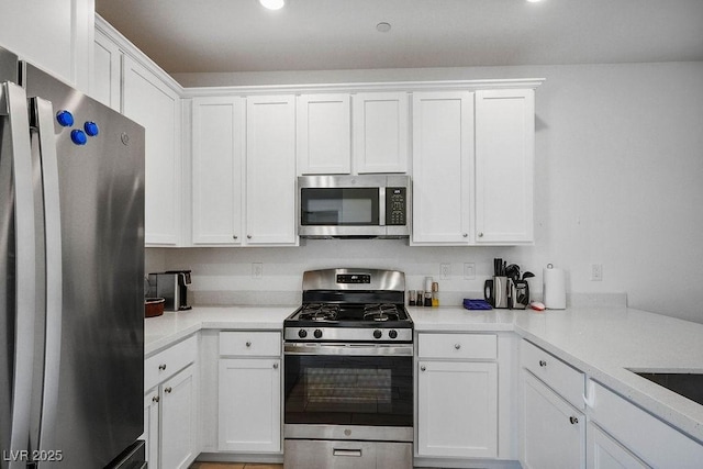 9740 Redwood Cascade St, Las Vegas, NV 89143 - kitchen featuring appliances with stainless steel finishes, white cabinetry, light countertops, and recessed lighting