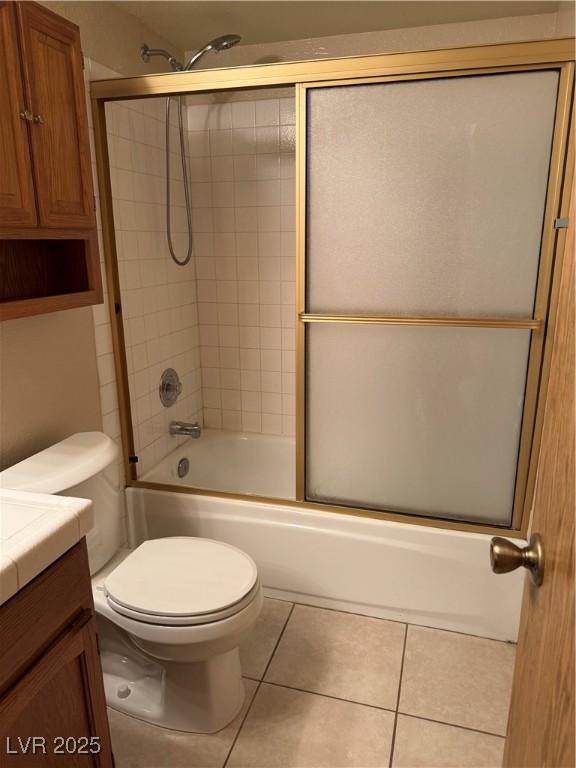 4231 Sanderling Cir Unit 267, Las Vegas, NV 89103 - bathroom with vanity, tile patterned floors, and shower / bath combination with glass door