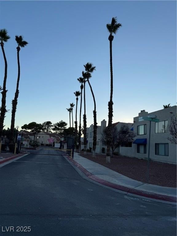 4231 Sanderling Cir Unit 267, Las Vegas, NV 89103 - view of asphalt street with sidewalks, curbs, a gate, and a gated entry