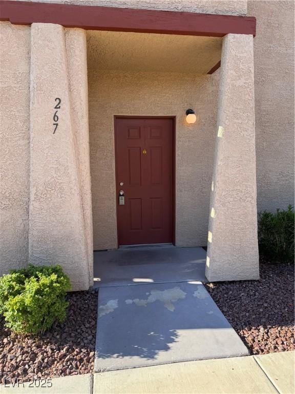 4231 Sanderling Cir Unit 267, Las Vegas, NV 89103 - doorway to property with stucco siding