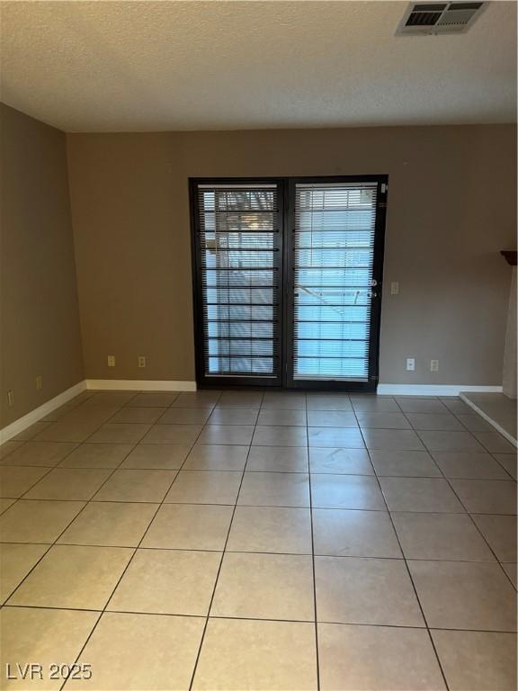 4231 Sanderling Cir Unit 267, Las Vegas, NV 89103 - unfurnished room featuring light tile patterned floors and a textured ceiling