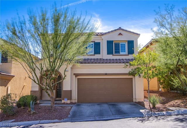 10633 Mount Blackburn Ave, Las Vegas, NV 89166 - view of front of home featuring stucco siding, driveway, a tile roof, and an attached garage
