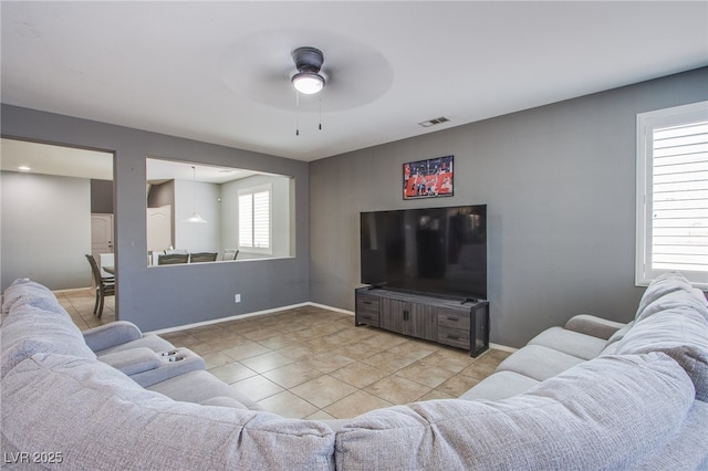 10633 Mount Blackburn Ave, Las Vegas, NV 89166 - living room with a ceiling fan and tile patterned floors
