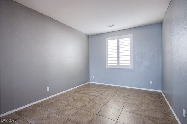 10633 Mount Blackburn Ave, Las Vegas, NV 89166 - spare room featuring baseboards and tile patterned flooring
