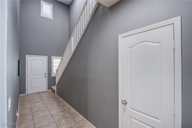 10633 Mount Blackburn Ave, Las Vegas, NV 89166 - entryway with stairway and light tile patterned floors