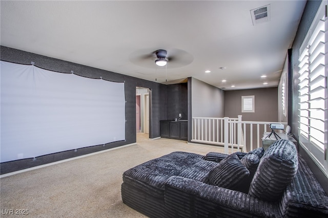 10633 Mount Blackburn Ave, Las Vegas, NV 89166 - cinema room with light colored carpet, a ceiling fan, and recessed lighting